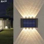 Set 2 lampi solare LED de perete cu iluminare dubla RAZO, Senzor zi-noapte, Iluminare sus-jos, Efect decorativ modern, Alimentare solara fara cabluri, Pornire automata, Design compact, Rezistent la apa