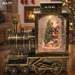 Trenulet decorativ de Craciun RAZO, Glob LED, Efect ninsoare, Muzica, Scena cu Mos Craciun, Alimentare USB, baterii, 19x9.5x19 cm, Bronz antichizat